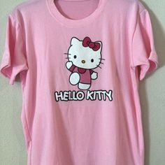 Baby Pink Hello Kitty T-Shirt Casual Pink Hello Kitty T-shirt, Pink Cotton Hello Kitty T-shirt, Trendy Pink Hello Kitty T-shirt, Trendy Cotton T-shirt With Hello Kitty Print, Cute Spring T-shirt With Cat Design, Pink Hello Kitty T-shirt For Spring, Playful Hello Kitty Print Cotton T-shirt, Cute Pink Hello Kitty T-shirt, Cute Hello Kitty Cotton T-shirt