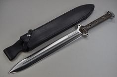 a knife and sheath sitting next to each other