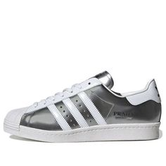 Adidas Superstar x Prada Shoes 'Silver White' FX4546 (SNKR) Modern Silver Sneakers With Metallic Logo, Silver Custom Sneakers With Rubber Sole For Streetwear, Custom Silver Sneakers With Rubber Sole For Streetwear, Luxury Silver Sneakers With Rubber Sole, Modern Silver Sneakers With Rubber Sole, Modern Silver Low-top Custom Sneakers, Silver Sneakers With Perforated Toe Box, Adidas Silver Sneakers With Boost Midsole, Adidas Silver Sporty Sneakers