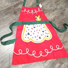 a child's apron that is on the floor