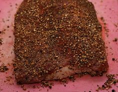 a piece of meat with seasoning on it