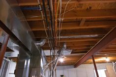 pipes and wires are hanging from the ceiling