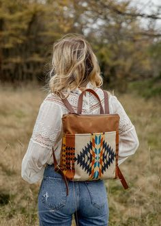 "Introducing our Tofino Backpack - a bag where, like its namesake, bohemia meets rugged utility. Made from durable & water resistant waxed canvas and featuring a front pocket made from our newest most beautiful luxury wools from the historic Pendleton Mills. The Tofino Backpack is a bag that can hold its own on a back country trail or city streets.  * Made from American made tan waxed canvas * Featuring luxury blanket weight wool front pocket * Solid waxed canvas backing * Brown cowhide adjustable backpack straps * Thick natural off-white canvas lining with one inner pocket * Measures 14\" across x 12\" in height to 3\" gusset * Brass YKK metal zipper and leather zipper pull * Handle on top with a 3\" drop Waxed canvas is a durable, weather resistant material that can be wiped clean. This Pendleton Bag, Stylish Laptop Bag, Hipster Backpack, Stylish Diaper Bag, Boho Backpack, Waxed Canvas Backpack, Brown Cowhide, Utility Bag, Beautiful Handbags