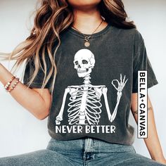 "Our \"Never Better Skeleton Halloween Shirt\" is the ideal choice for those seeking a dash of humor during the spooky season! With its witty and sarcastic saying, this shirt is bound to garner laughs at Halloween gatherings and parties. Embrace the fun side of Halloween with this unique and eye-catching tee, making it a fantastic way to add humor to your celebrations and stand out in the crowd. Whether you're trick-or-treating, attending a costume party, or simply savoring the fall season, this shirt is sure to be a hit, allowing you to get into the Halloween spirit with style and humor. 🎃🍂 #FunnySkeletonShirt #SarcasticHalloweenTee #SpookySeasonHumor 💀🧡 Hi!  Welcome. It's great to see you here! ☺️ Our shirts are clean, high quality and soft. It is prepared quickly by our boutique.  I Never Better Skeleton, Never Better, Christmas Tee Shirts, Funny Skeleton, Skeleton Shirt, Halloween Vibes, Sarcastic Shirts, Funny Mom Shirts, Halloween Png