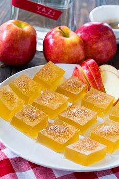 sliced apples and cubes of caramel cheese on a plate