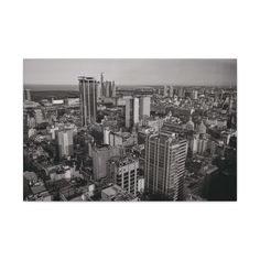 black and white photograph of cityscape taken from the top of a tall building