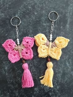 three crocheted butterfly key chains with tassels