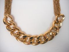 A stylish chain necklace with made of stainless steal in gold tone Very good vintage condition. Lenght:51 cm / 20.1 inches width of the metal plates : 2 cm / 0.8 inches Gold Layered Necklace With Chunky Chain Links, Multi-strand Metal Chain Necklace With Gold Chain, Gold Metal Chain Necklace Costume Jewelry, Vintage Gold Multi-strand Chain Necklace, Gold Multi-strand Metal Chain Necklace, Gold-tone Double Chain Metal Necklace, Gold-tone Metal Double Chain Necklace, Gold Metal Layered Necklace In Costume Jewelry Style, Gold Metal Layered Necklace For Costume Jewelry