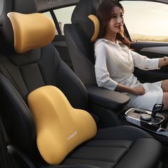 a woman sitting in the driver's seat of a car with her feet up