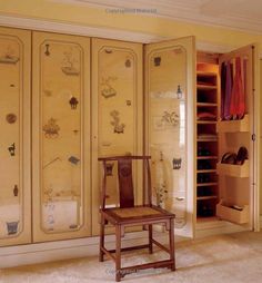 a chair sitting in front of a closet filled with jewelry