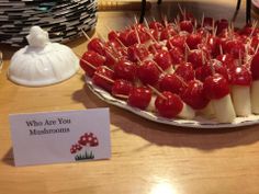 there is a platter of food on the table with toothpicks in it