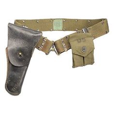 a belted holster with two small pouches