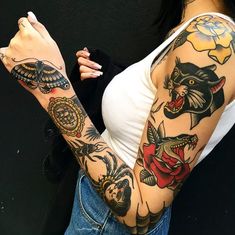 a woman with many tattoos on her arm