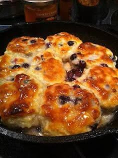 a skillet filled with food sitting on top of a stove