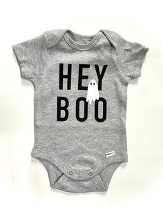 Hey Boo Onesie | Halloween Onesie | Cute Ghost Onesie | Halloween Kids T shirt | First Halloween Toddler Kids | Hey Boo | Halloween Baby by TinyNative on Etsy Funny Fitted Black Onesie, Playful Black Short Sleeve Onesie, Fitted Short Sleeve Fun Bodysuit, Fun Fitted Short Sleeve Bodysuit, Funny Graphic Print Short Sleeve Bodysuit, Playful Short Sleeve Bodysuit With Character Print, Fitted Short Sleeve Bodysuit With Cartoon Print, Fitted Halloween Onesie For Playtime, Fitted Onesie For Halloween Playtime