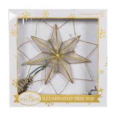 a christmas ornament in the shape of a star with gold trimmings