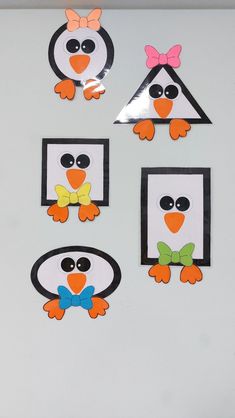 penguins with bow ties and frames cut out from paper