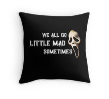 a pillow with the words, we all go little mad sometimes and a skull on it