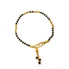 This exquisite 22kt gold mangalsutra hand bracelet is a perfect blend of traditional significance and contemporary elegance. The bracelet features gorgeous black beads interspersed with gleaming gold accents, creating a striking contrast that enhances its beauty. Crafted from high-quality 22kt gold, it radiates a luxurious glow, symbolizing both purity and prosperity. Lightweight and comfortable, this bracelet is designed for women who appreciate both tradition and style. Ideal for gifting, it s Personalized Silver Jewelry, Gold Pendent, Couples Quotes, Gold Mangalsutra, Light Weight Jewelry, Gold Armband, Jewelry Simple, Hand Bracelet, Jewelry Black