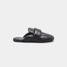 Prada puffy lambskin leather loafer mules with signature triangle logo accent 0.17 in / 5 mm flat heel Round apron toe Notched vamp with strap Slide style Rubber outsole Made in Italy Loafer Mules, Triangle Logo, Lambskin Leather, Leather Loafers, Apron, Prada, Tops Designs, Loafers, Walking