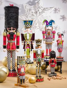 nutcrackers, figurines and other decorations on a table