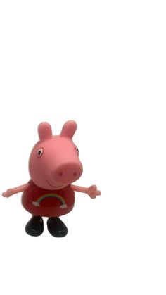 a toy pig is standing in the air