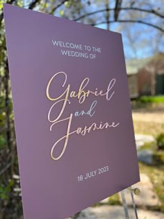 a welcome sign for the wedding of gabbie and jasmine