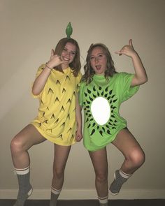 two women in costumes posing for the camera