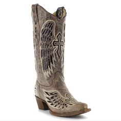 The Corral Taupe & Black Wing And Cross Cowgirl Boots. Style #A1241. Made With A Taupe Grayish Brown Distressed Leather And Accented With Wing And Cross Cut-Out Designs. Shiny Black Sequins Inlaid In The Angel Wing Designs. We Love The Pop Of White Embroidery Outlining The Wing And Cross Design. Handmade In Mexico These Boots Are Created By Artisans Using The Best Quality Materials. Leather Soles, Stacked Leather Riding Style Heel, Lightly Cushioned Leather Insoles, Snip Toe, And Fully Leather Lined. Tube Height 13" Heel Height 2 3/8" Size 9 M (Regular Width) Great Pre-Owned Condition. These Have Only Been Worn 9-10x. Light Wear On Soles & Heels. Bit Of Dirt Caught In Tiny Grooves On B Snip Toe Cowgirl Boots, Leather Cowgirl Boots, Boots Store, Corral Boots, Boots Style, Black Wings, Western Chic, Western Boots Women, Cowboy Style