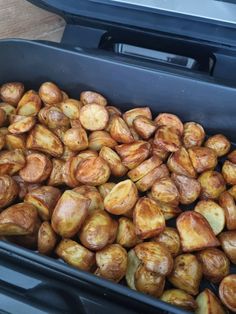 roasted potatoes in an open black container