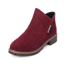 a women's red boot with brown soles