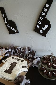 a football themed birthday party with cake and cupcakes