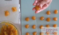 there are some oranges being peeled and placed on the table next to each other