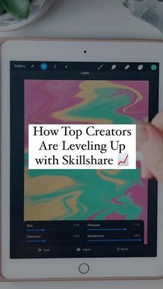 a person holding an ipad with the text how top creators are leveling up with skillshare