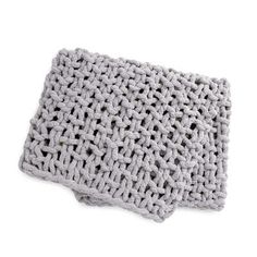 a gray crochet dishcloth on a white background with clipping for text