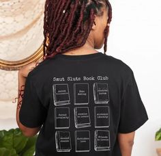 a woman with dreadlocks wearing a black t - shirt that says smart stitch book club