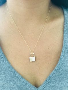 "Padlock Necklace * 14k gold filled Beautiful padlock necklace! The pendant is made of thick 18k gold filled. Great quality and fun to layer with other necklaces. d e t a i l s -- 14k gold filled chain -- 14k gold filled spring clasp closure -- 18k gold filled padlock measure 20MM * model is wearing 18\" Necklace comes in a kraft jewelry box with a bow on top h o w * t o * o r d e r 1. please select options from the dropdown menu 2. add to cart and proceed to checkout 3. then place your order g Personalized Gold Jewelry For Everyday Use, Everyday Gold Jewelry With Lock Detail, Everyday Gold Lock Jewelry, Yellow Gold Necklace With Lock As Gift, Gold Chain Necklace With Lock For Gift, Luxury Lock Necklace As Gift, Lock Pendent Necklace, Gold Padlock Necklace, Padlock Necklace