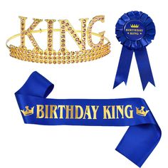 a blue ribbon with the words birthday king on it and a crown next to it