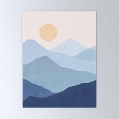 a painting with mountains and the sun in the background is shown on a white wall