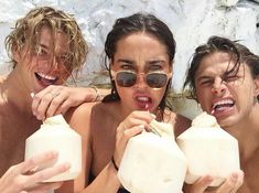 three people are drinking milk and having fun