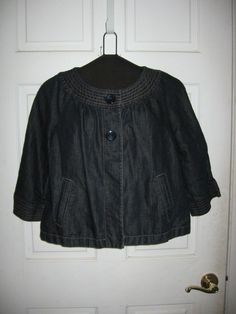 This is a very nice Ann Taylor dark denim jacket with 3/4 length sleeves. I did have to replace the buttons on this jacket due to one being lost. Laying flat the jacket measures 20" from armpit to armpit and is 20" long from the top of the collar. The sleeve measures 18" from the bottom of the collar to the end of the sleeve. The material is 60% cotton and 40% linen. Thanks for looking. Casual Outerwear With 3/4 Sleeve And Buttons, Casual Outerwear With Buttons And 3/4 Sleeves, Cotton Outerwear With 3/4 Sleeve For Fall, Casual Cotton Outerwear With 3/4 Sleeves, Fall Cotton Outerwear With 3/4 Sleeve, Dark Denim Jacket, Dark Denim Jeans, Blazer With Jeans, To The End