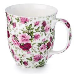 a coffee cup with pink flowers on it next to a flowery red rose or peonie