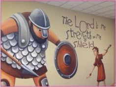 the mural is painted on the wall in the children's playroom, which features an image of a knight and a woman