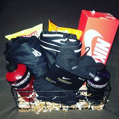 a basket filled with sports gear and snacks