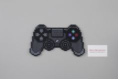 a video game controller made out of perler beads