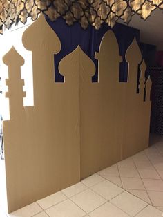 the walls are made out of cardboard and decorated with intricate designs