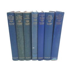 four blue books are lined up in a row