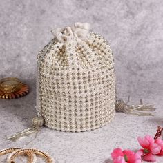 About This Item Introducing THE TAN CLAN Embroidered Embellished Potli Bag--a premium accessory designed to elevate your style for any special occasion. This luxurious drawstring purse is the perfect addition to your collection, ideal for weddings, festive celebrations, Diwali, New year, Christmas, bridesmaid, anniversary, engagements, baby shower and other significant events. Description: THE TAN CLAN Embellished Potli Clutch | Premium Women Pouch | Elegant Wedding Purse for Girls | Luxurious D Potli Purse, Drawstring Purse, Embroidered Clutch, Wedding Purse, Potli Bags, Pouch Bag, White Pearl, Flap Bag, Girls Accessories