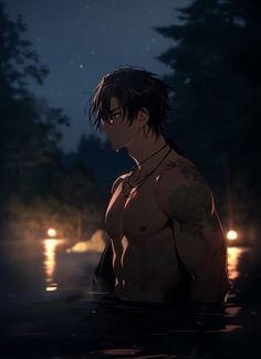 a shirtless man standing in the water at night