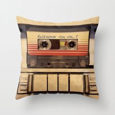 a pillow with an old school style cassette tape recorder printed on the front and sides